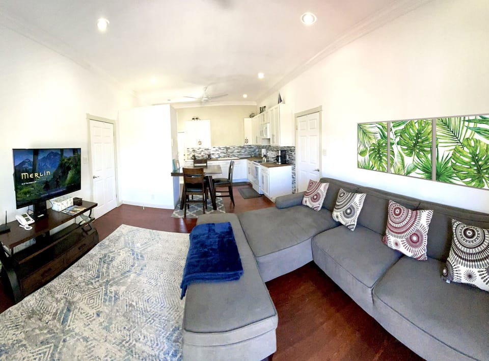 Open concept living, bright and cheerful, high ceilings, hardwood floors.