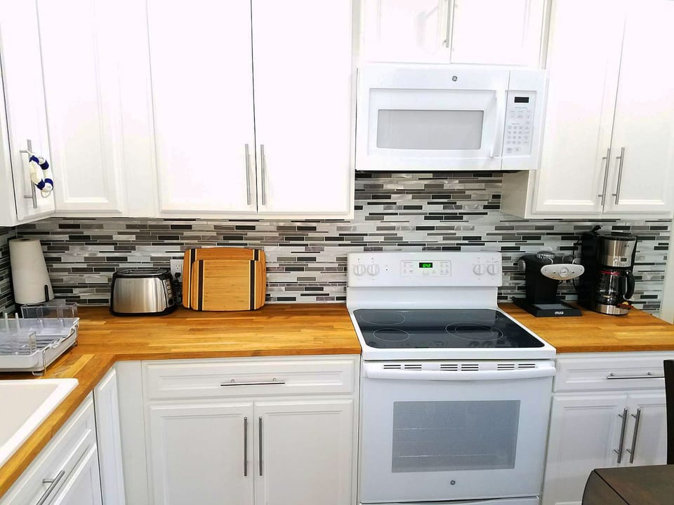 High end kitchen with Ikea cabinets. Coffee maker, Expresso and Capuccino maker.
