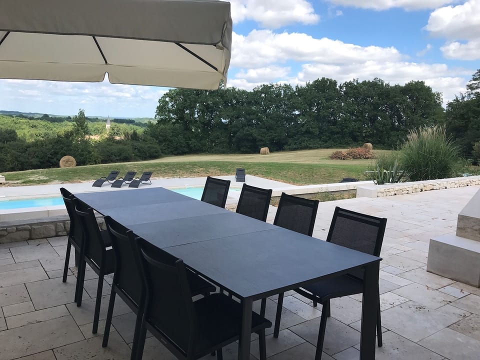 Alfresco dining on an expansive terrace with fabulous views of local villag