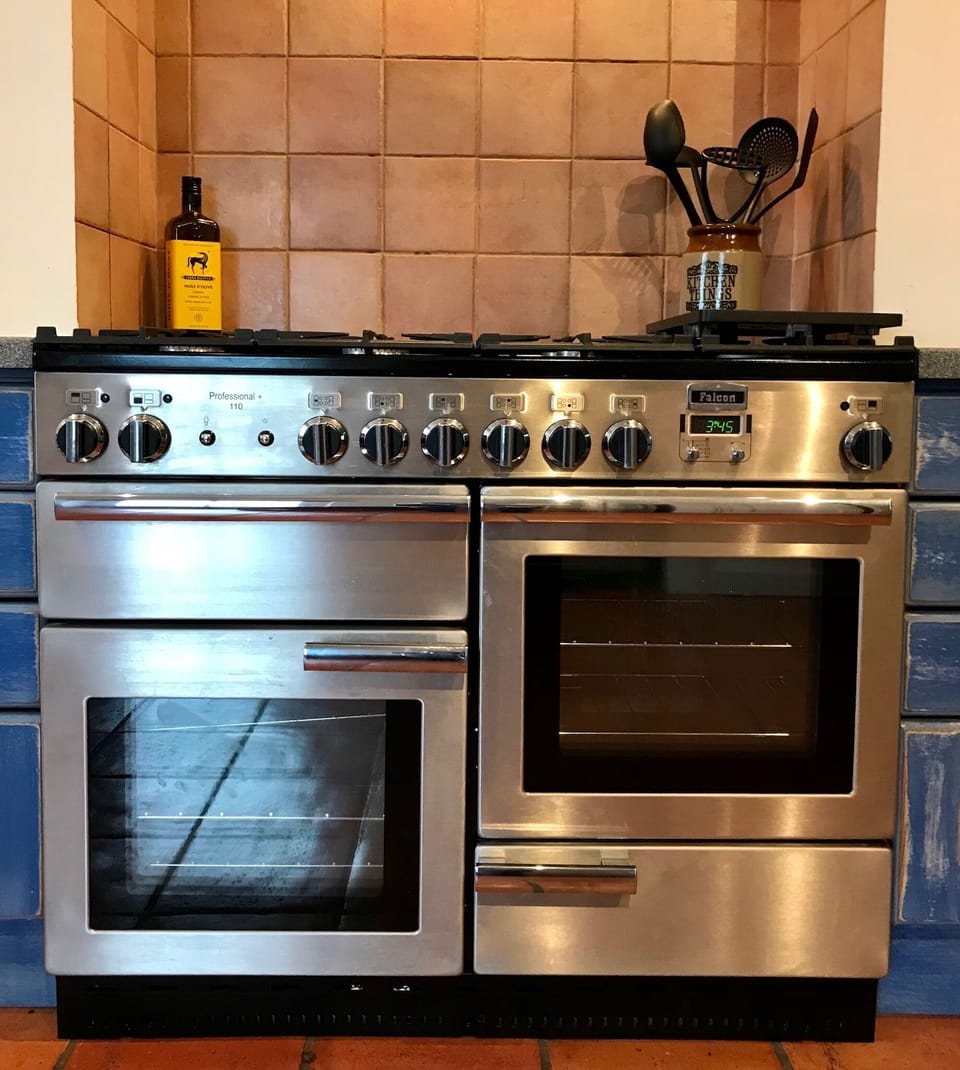Six-burner stove with double oven and grill