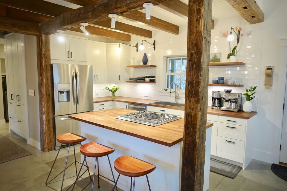 Kitchen features all-new top-quality wares and appliances, & walnut countertops.