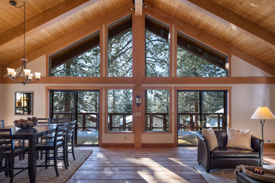 Floor to ceiling windows bring the outdoors into the great room.