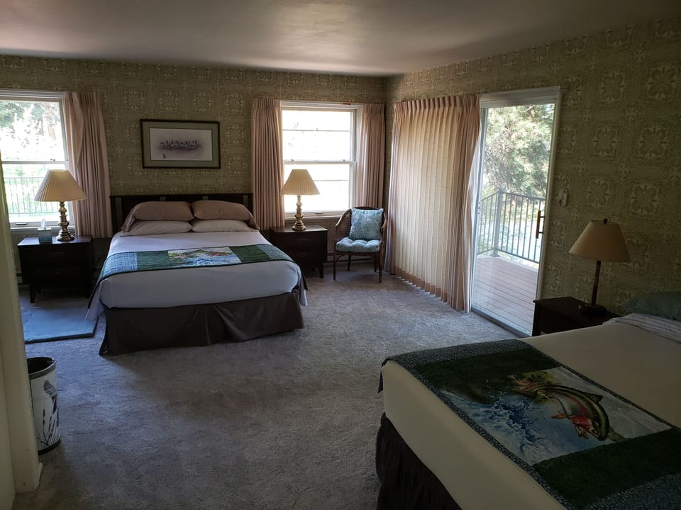 Master bedroom with sliding door to front deck (one queen, one full bed)