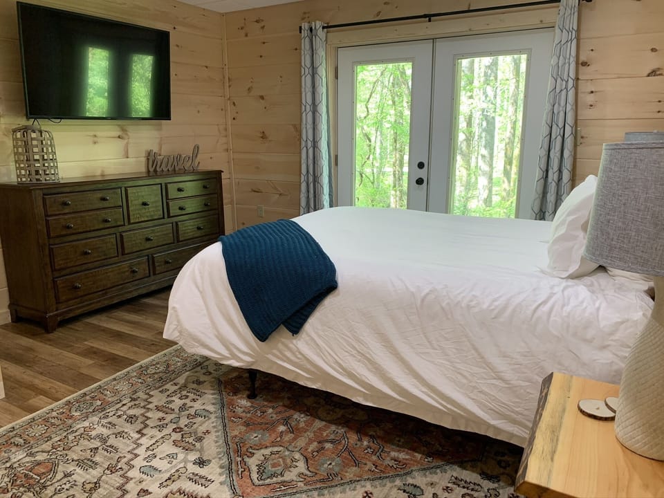 Newly Remodeled Downstairs Bedroom with doors that open to back patio