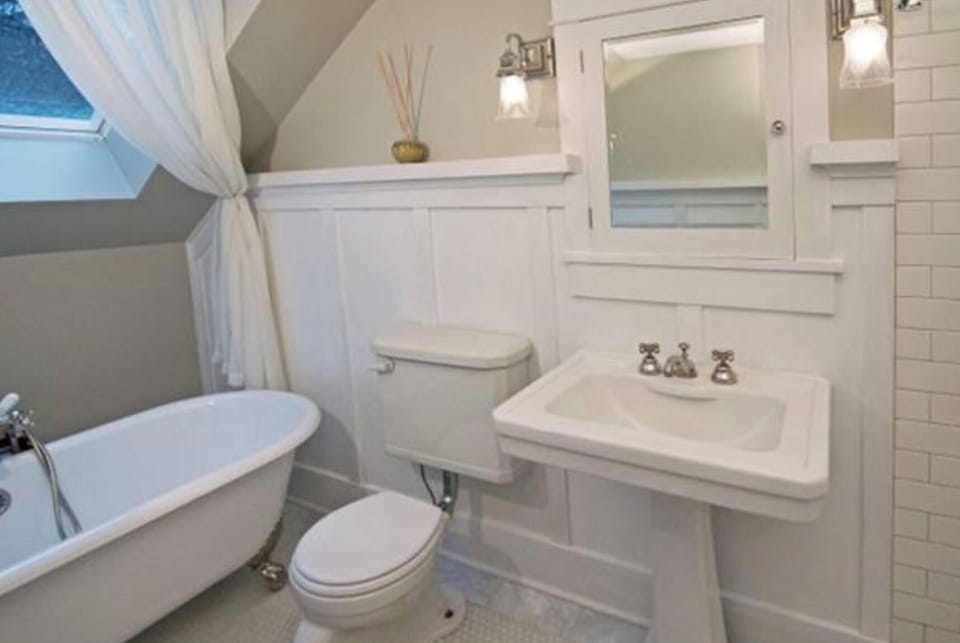 Gorgeous Bathroom with large Clawfoot tub and Skylight above!