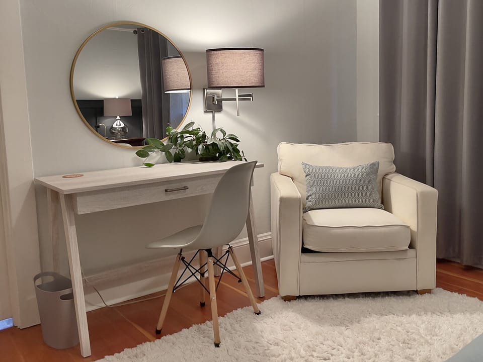 Spacious Queen Bedroom with desk, lounge chair, and walk in closet!