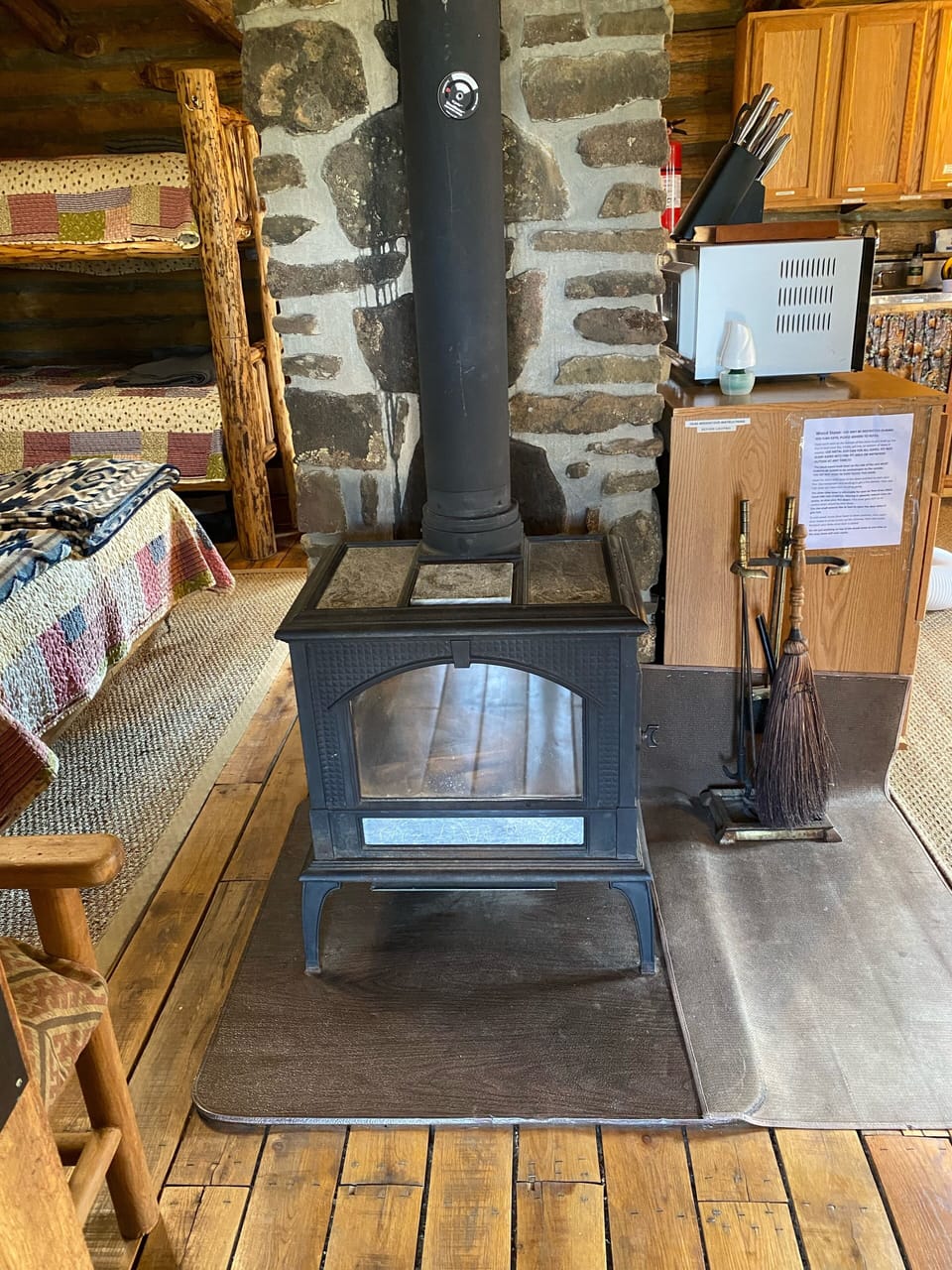 Wood stove inside cabin to keep it cozy in colder weather.