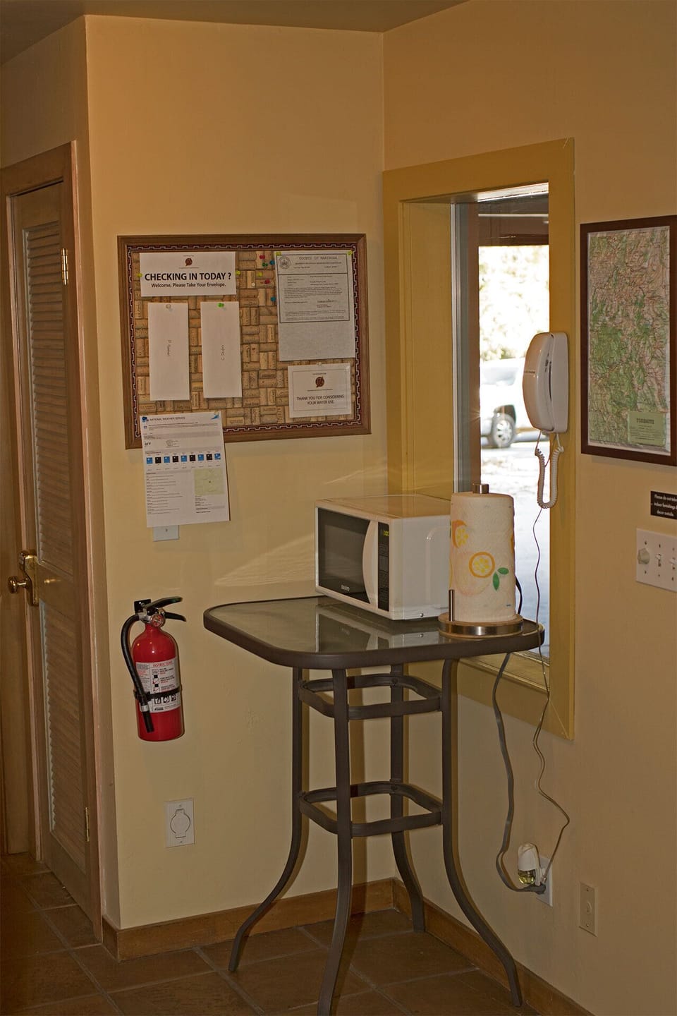 Entry hall has a small microwave.