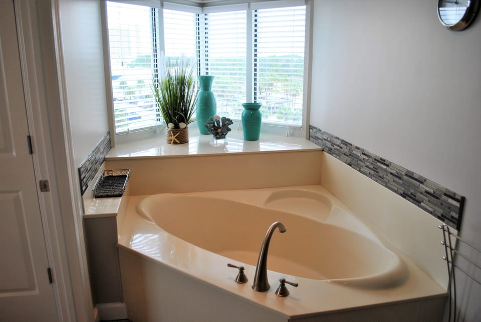 The tub in the Master has a sunset view.  This window looks west towards the pie