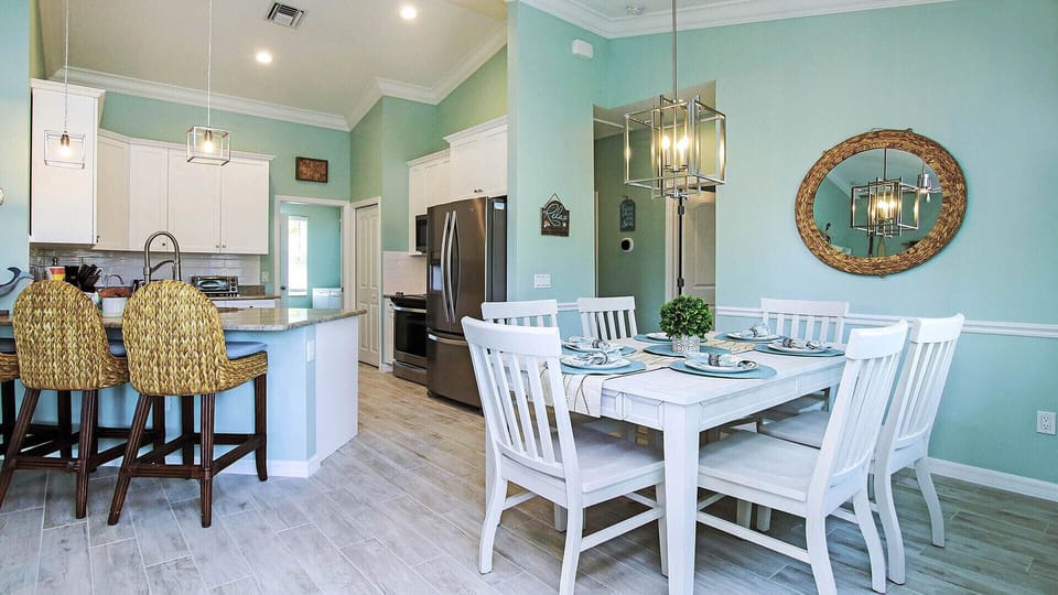 Kitchen/Dining with breakfast bar seating for 3 more.