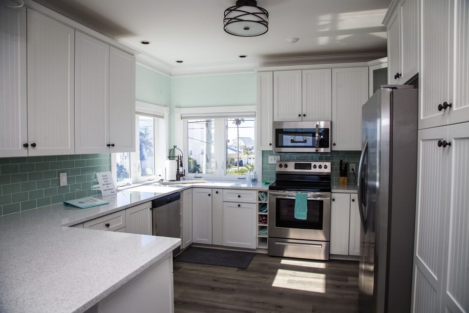 kitchen with new appliances and quartz countertops