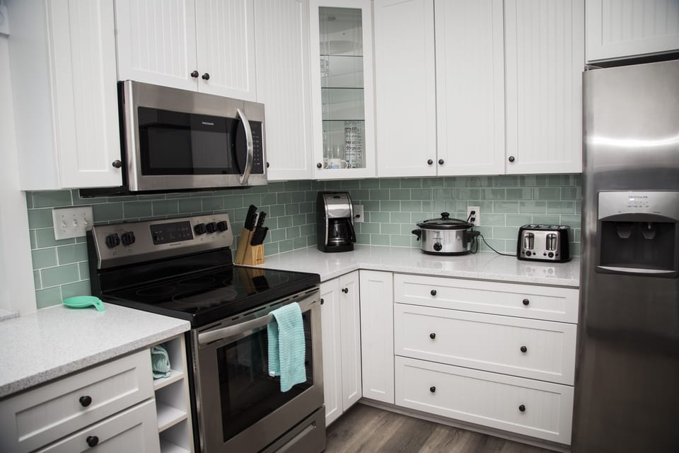 Keurig, coffee maker, crock pot, blender, waffle iron,and a toaster available