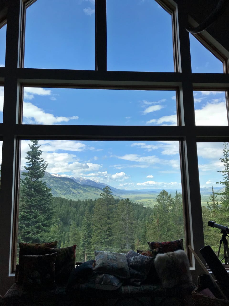 Great Room has floor to ceiling windows with views of the Grand Teton and JHMR 