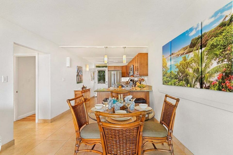 Spacious dining area with classic wooden furnishings, large wall art, and bright lighting ideal for family dinners or entertaining guests.