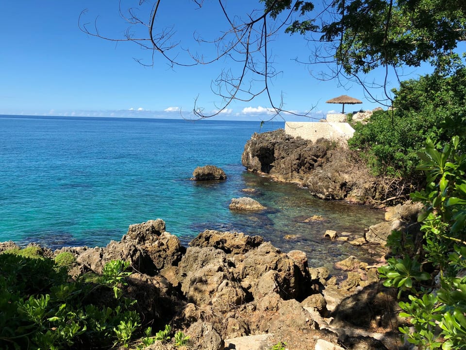 Turquoise water and rocky cliffs make the perfect scene for a picture.