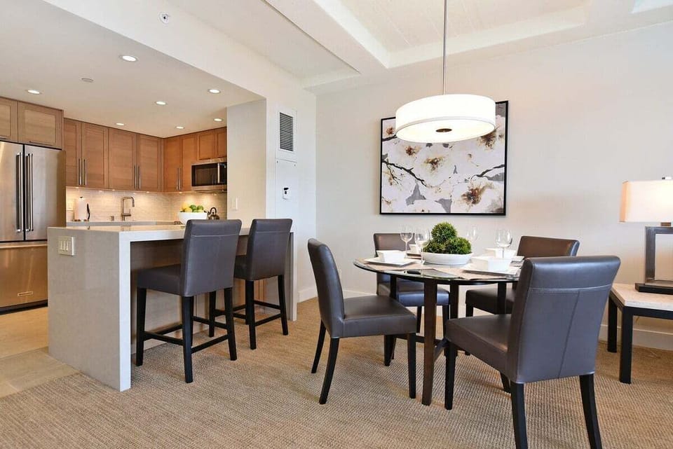 Enjoy meals at the four-seat table or have a casual snack at the kitchen bar seating. The kitchen has appliances for all your cooking needs.