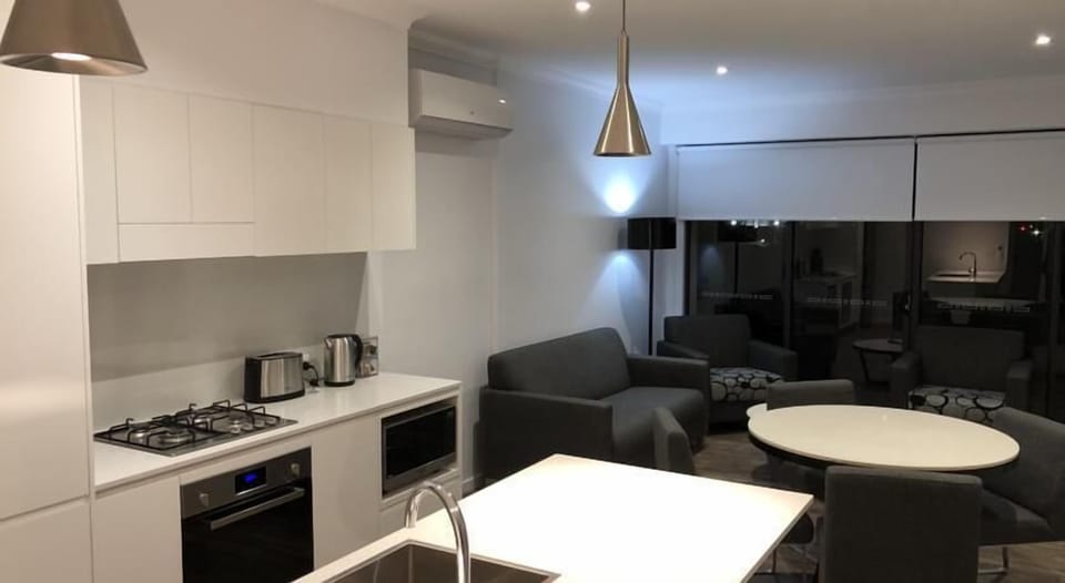 Apartment, 2 Bedrooms, 2 Bathrooms | Living area | 65-inch flat-screen TV with digital channels, TV