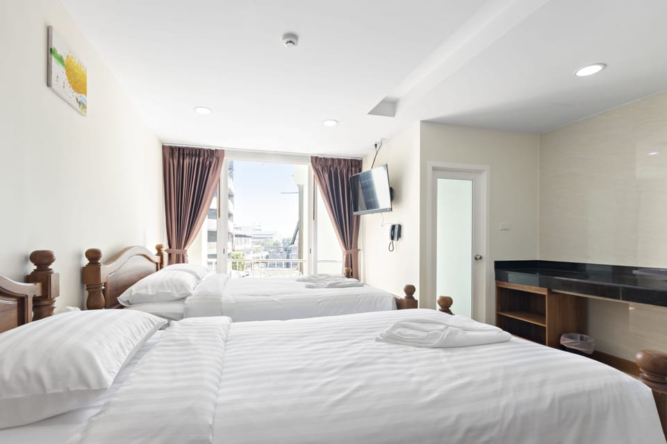 Triple Room | Blackout drapes, soundproofing, free WiFi