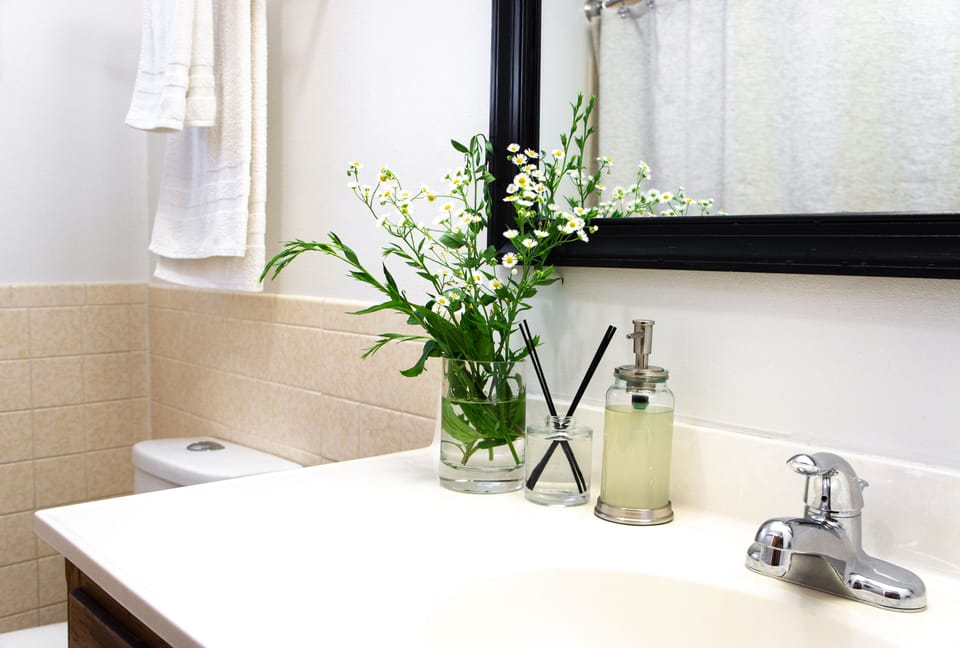 Main level full bath near bedrooms — with tub, shower, and Japanese-style bidet.