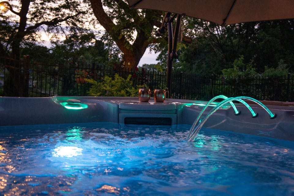 New 7-person saltwater hot tub on back patio.
