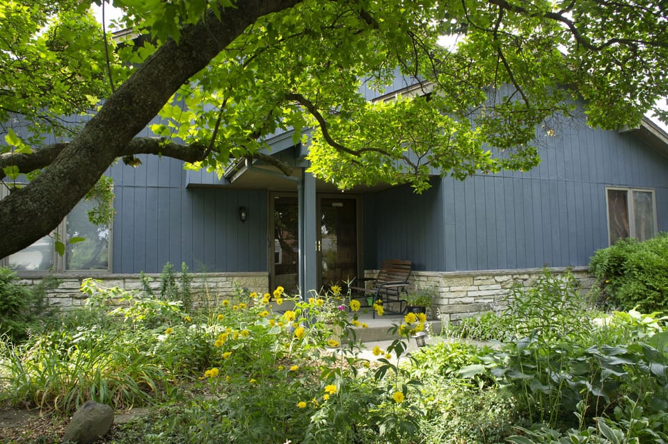 Home front entrance and perennial garden yard.
