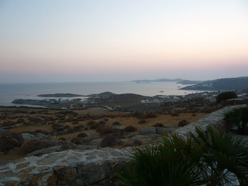 Views of the unspoiled natural landscape and of Mykonos bays, Delos and Rheneia