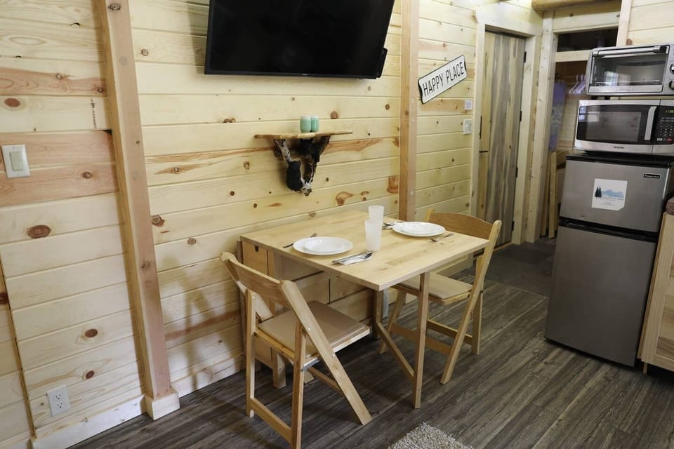 Dining area pulled out with chairs.  Perfect for two to five.  