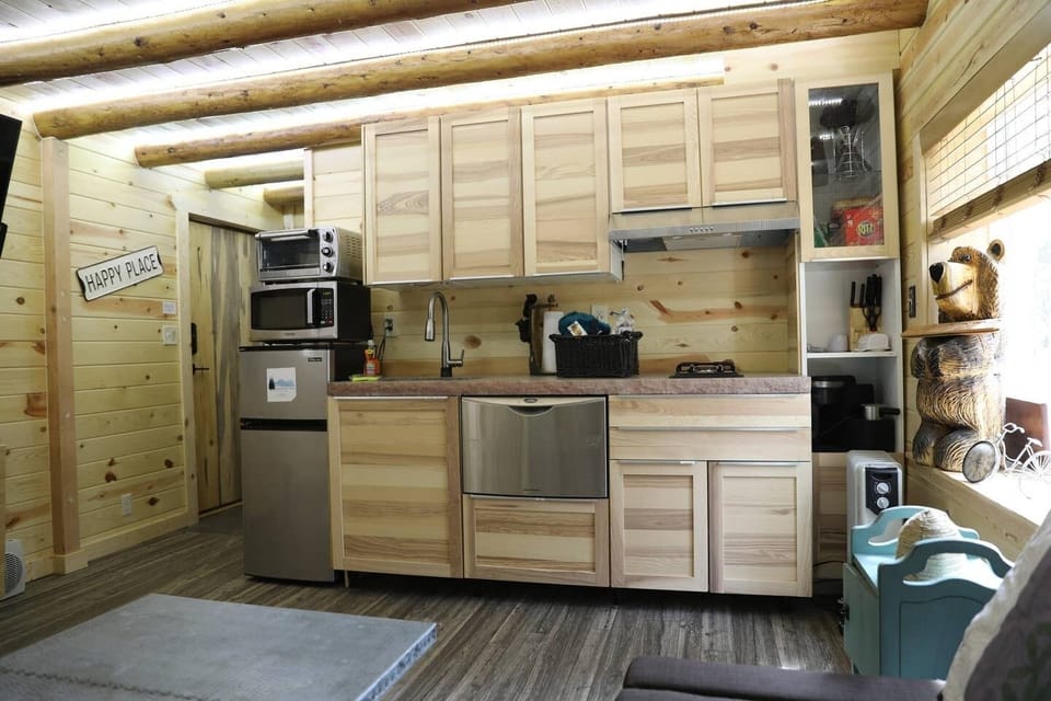 Studio kitchen with min fridge and freezer, toaster oven, microwave, stove top with 2 gas burners, dishwasher and garbage disposal.  We also have a Keurig coffee and espresso maker.
