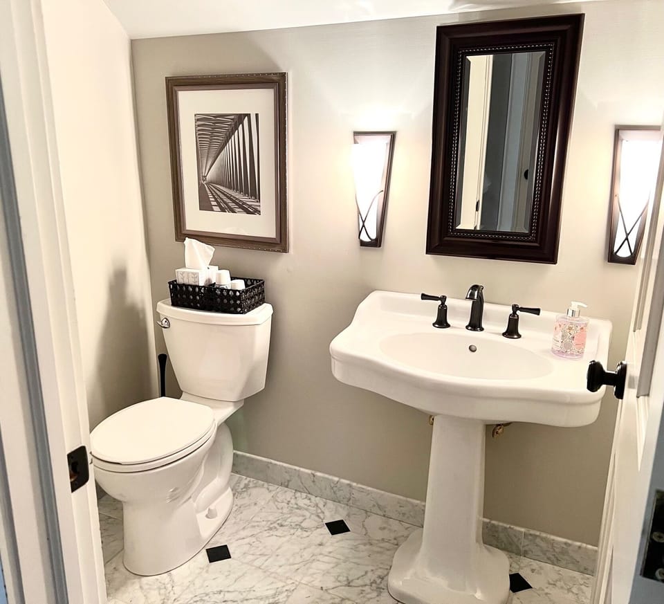 Bedroom suite 1 features a half bath