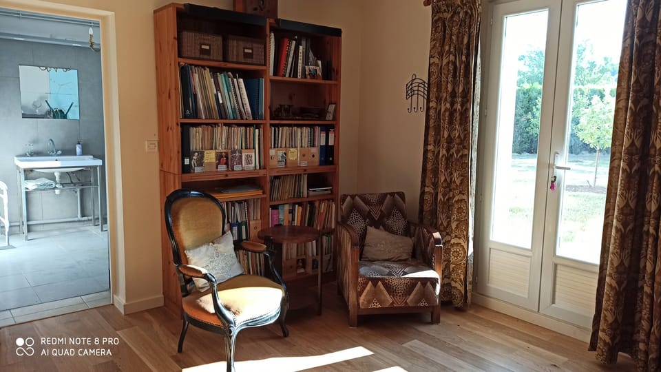 quiet sitting area in downstairs bedroom with access to orchard and shower room