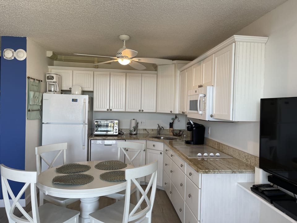 There's a new spacious refrigerator & toaster oven. Plus micorwave & cooktop.
