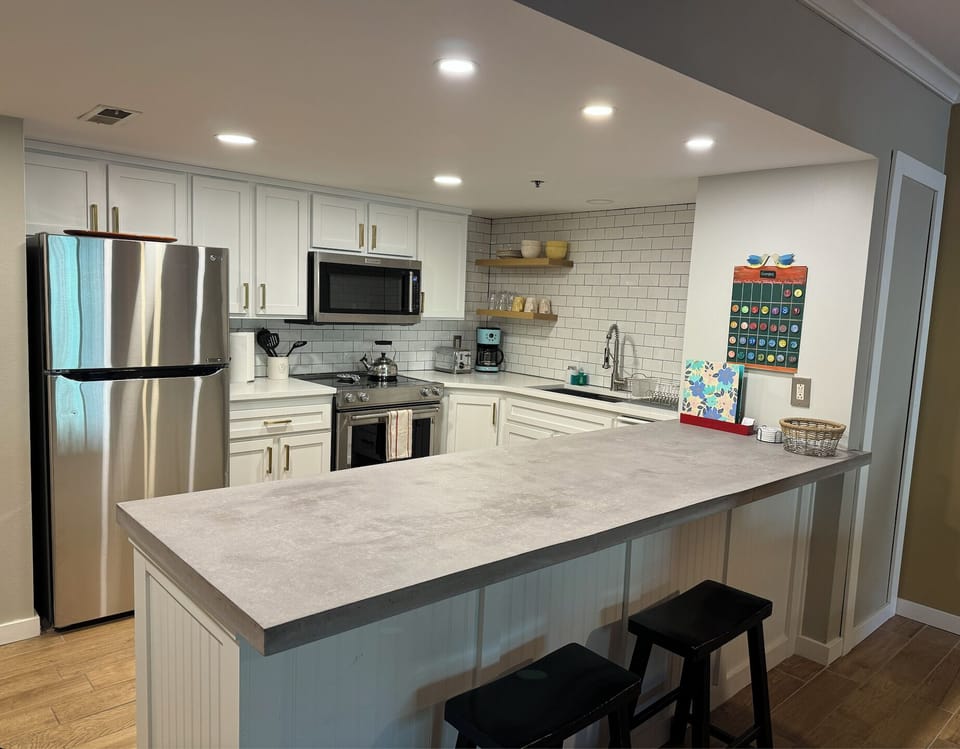 Spacious fully stocked kitchen.