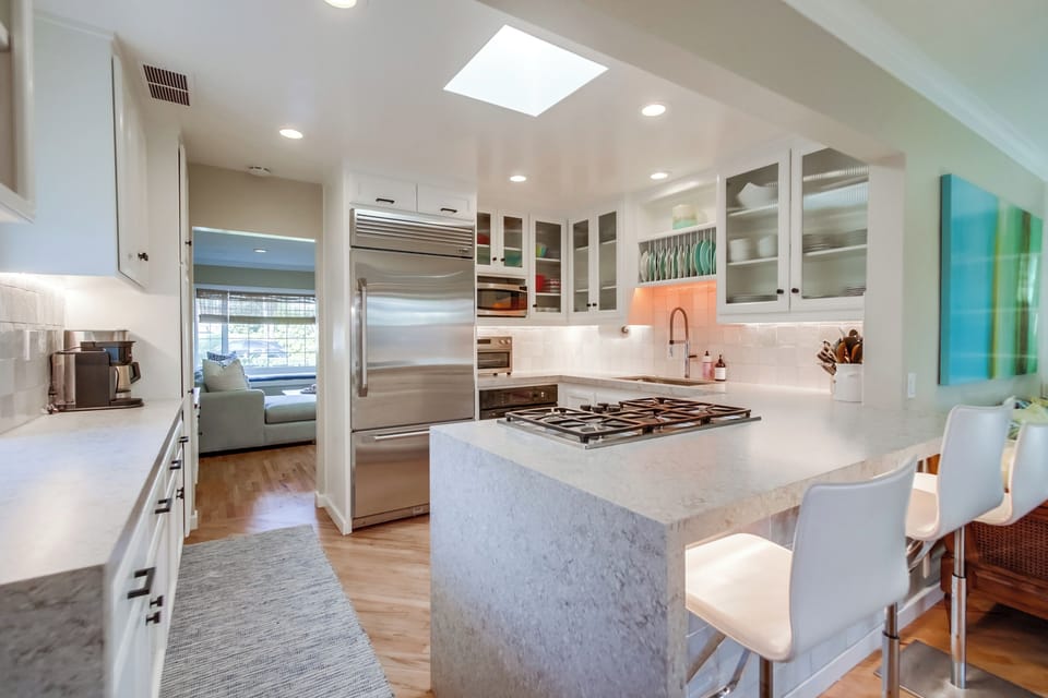 Two coffee machines, toaster oven, microwave, etc