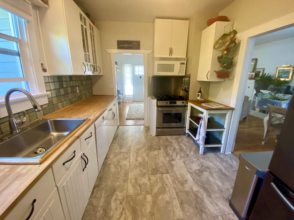 Gas stove top, microwave, dishwasher and  all the kitchen ware you will need
