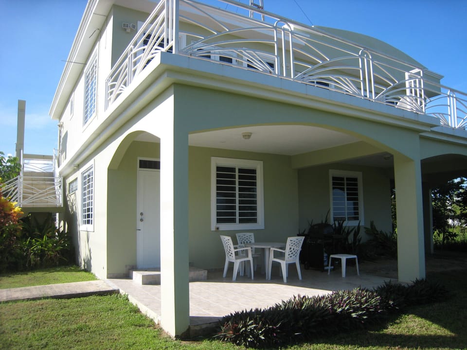 Patio with outdoor furniture and gas grill.