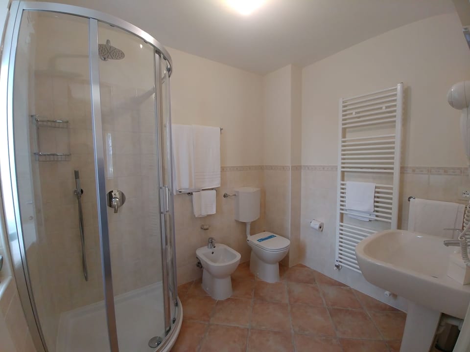 Shower, free toiletries, hair dryer, slippers