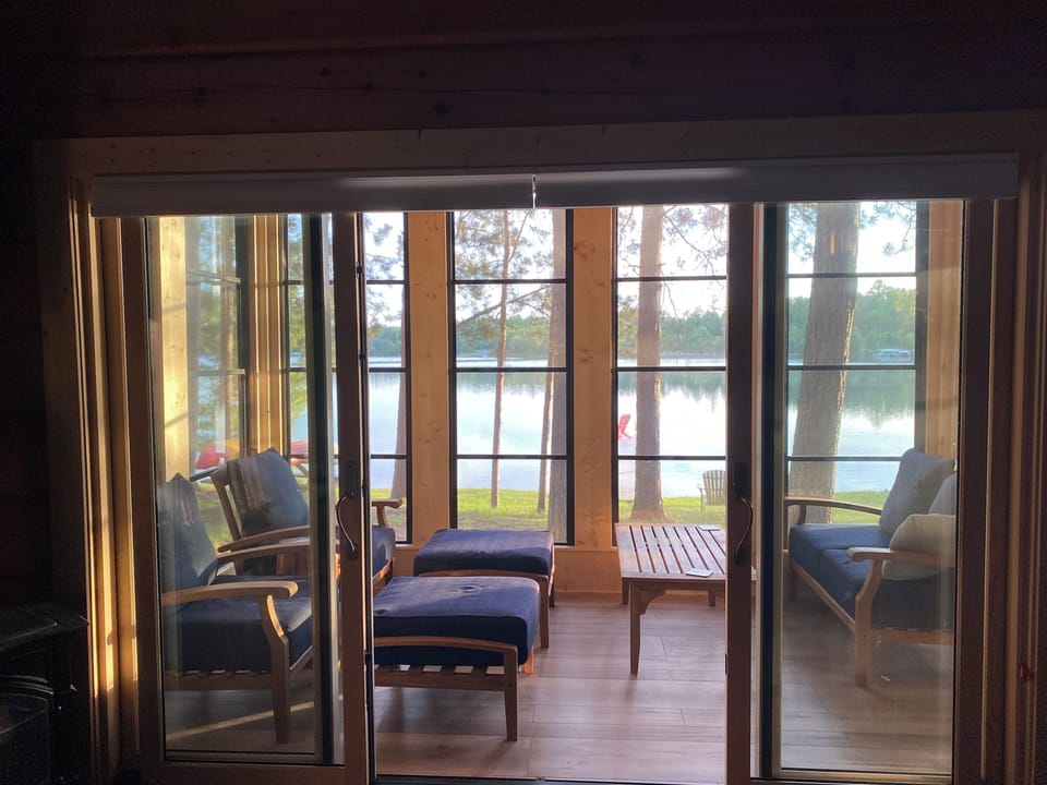 Enclosed 3-season porch overlooking Trout Lake. 