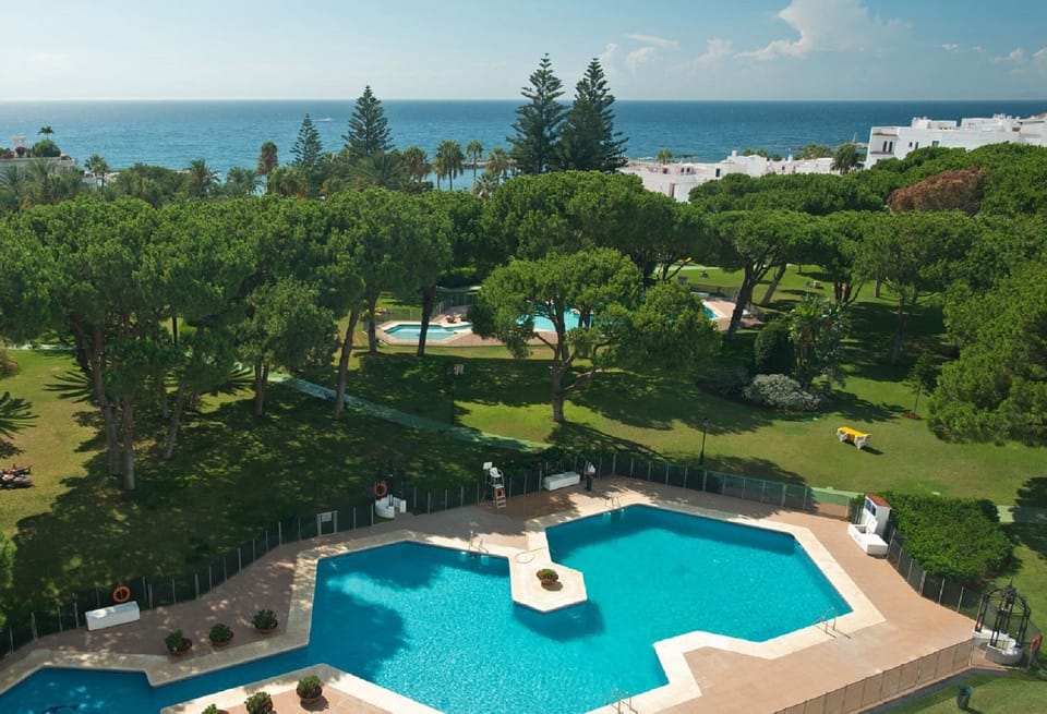 Partial aerial view of beach-front Club Playas del Duque gardens 