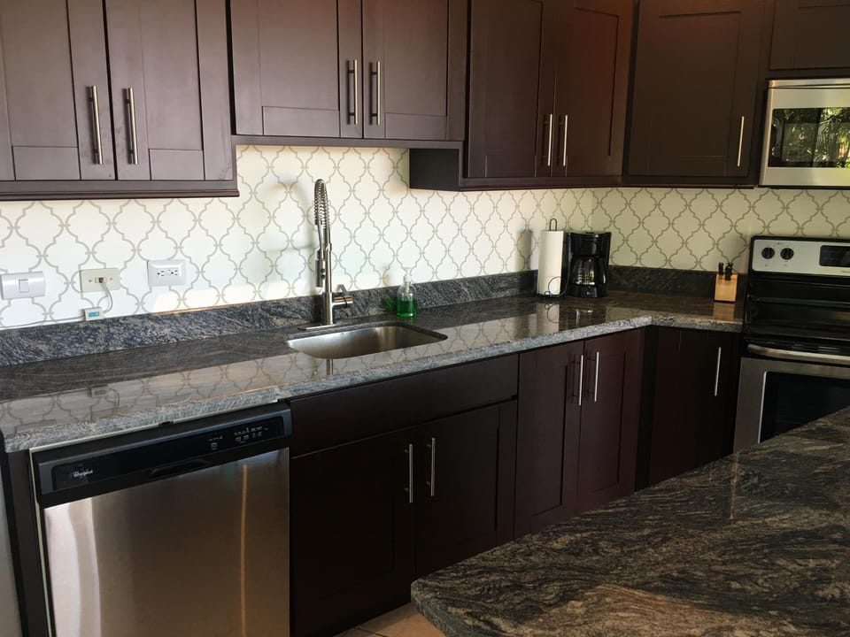 Fully appointed open concept kitchen with granite island