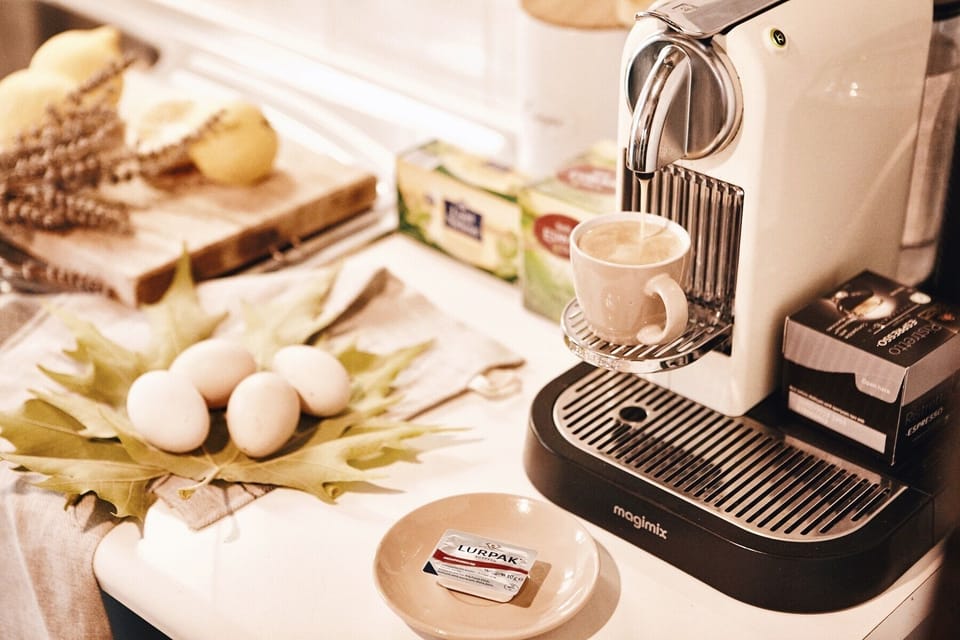 Nespresso machine with complimentary pods.