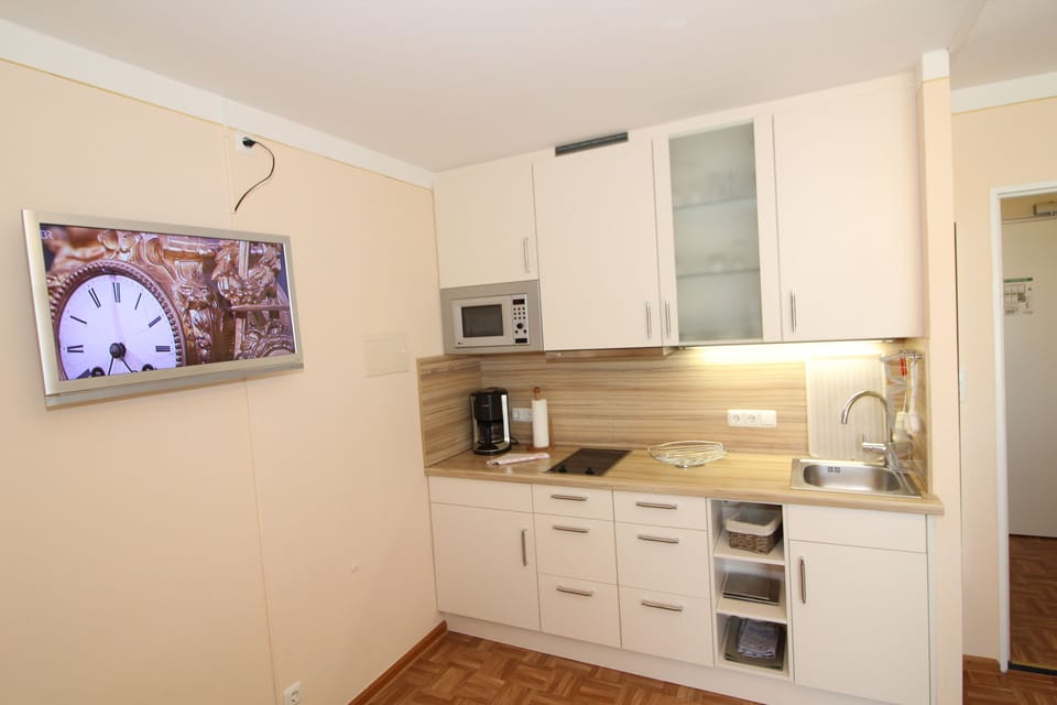 Fridge, stovetop, coffee/tea maker, electric kettle