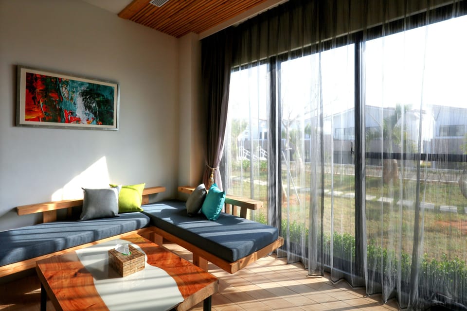 Elite Quadruple Room, 2 Queen Beds, Courtyard View, Courtyard Area | Living area | Flat-screen TV