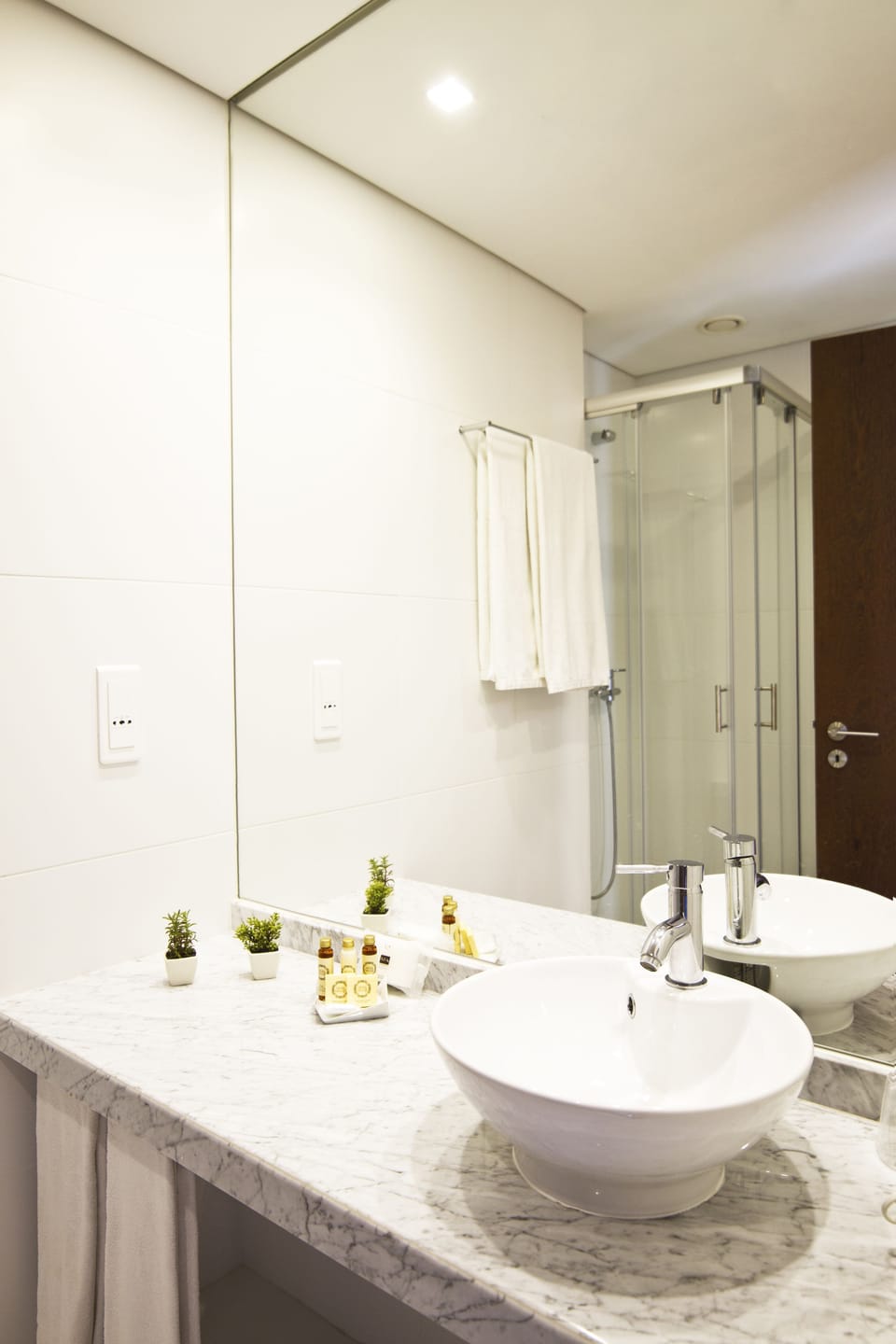Shower, designer toiletries, hair dryer, towels