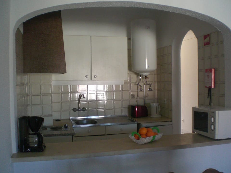 Apartment, 1 Bedroom | Private kitchen | Fridge, microwave, stovetop, coffee/tea maker