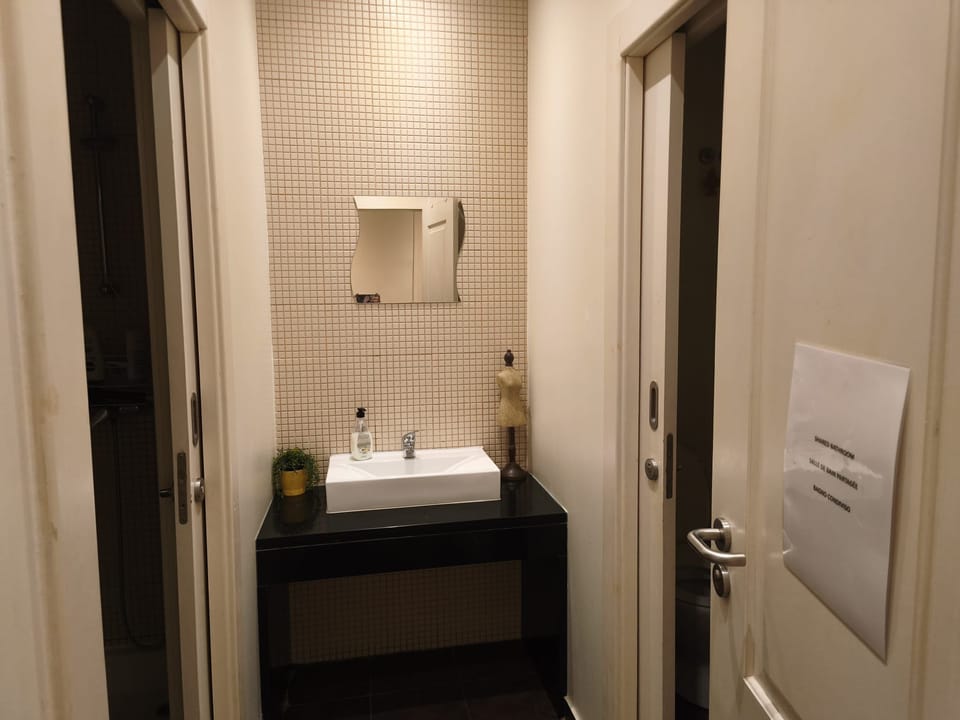 Economy Double Room, Shared Bathroom | Bathroom | Shower, rainfall showerhead, hair dryer, slippers