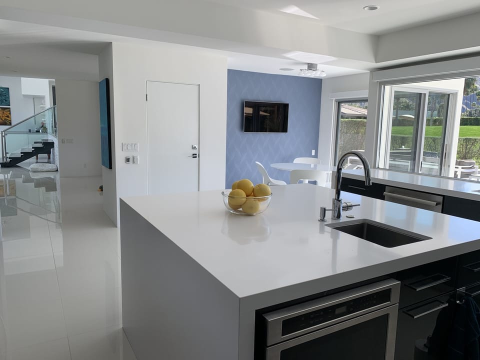 Large island with prep sink so everyone can pitch in, or just hang with the chef