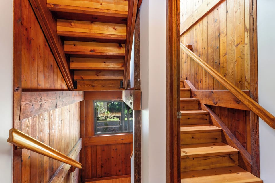 Stairs from mid level to upper living level