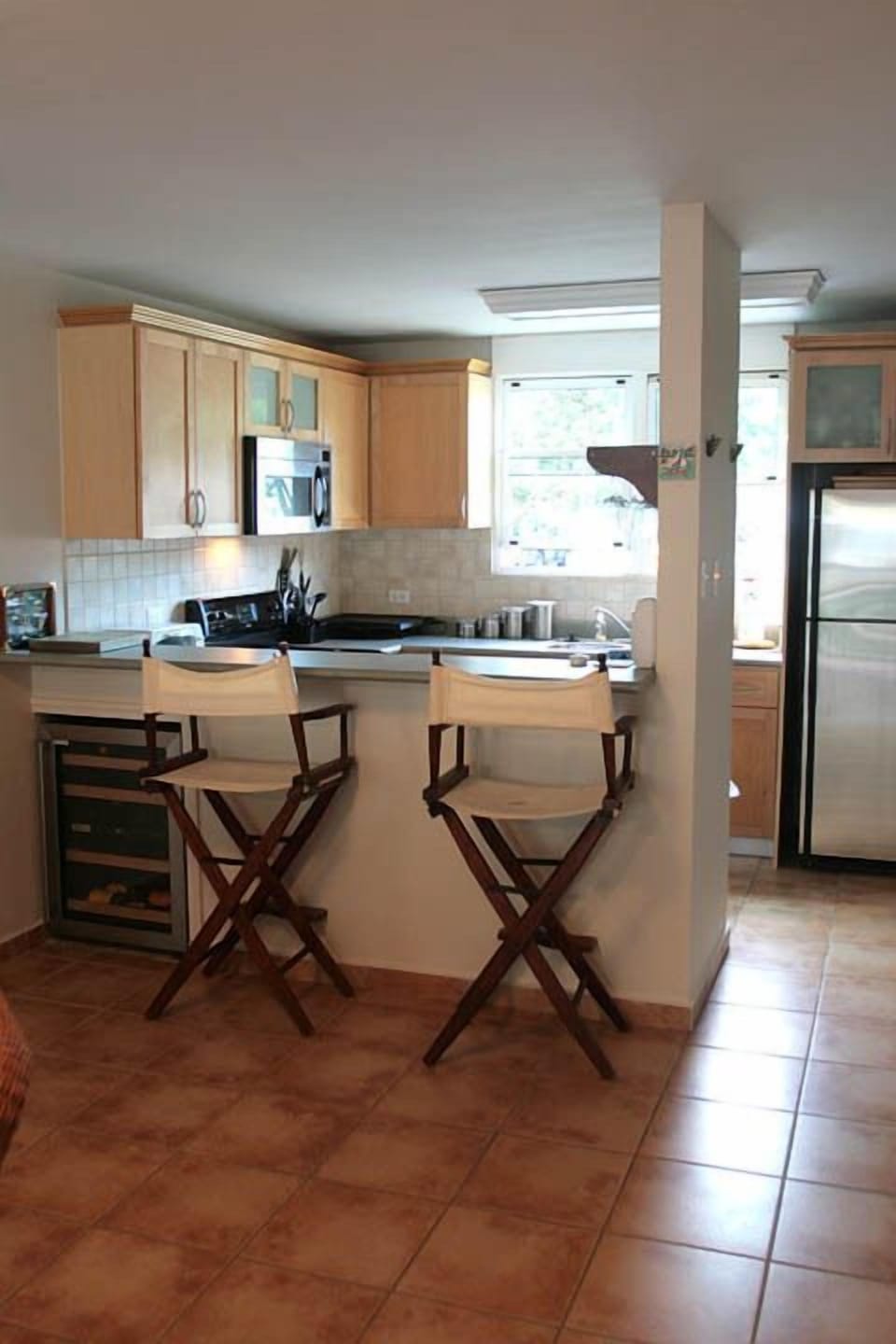Full Kitchen with wine cooler, dishwasher, microwave, toaster oven