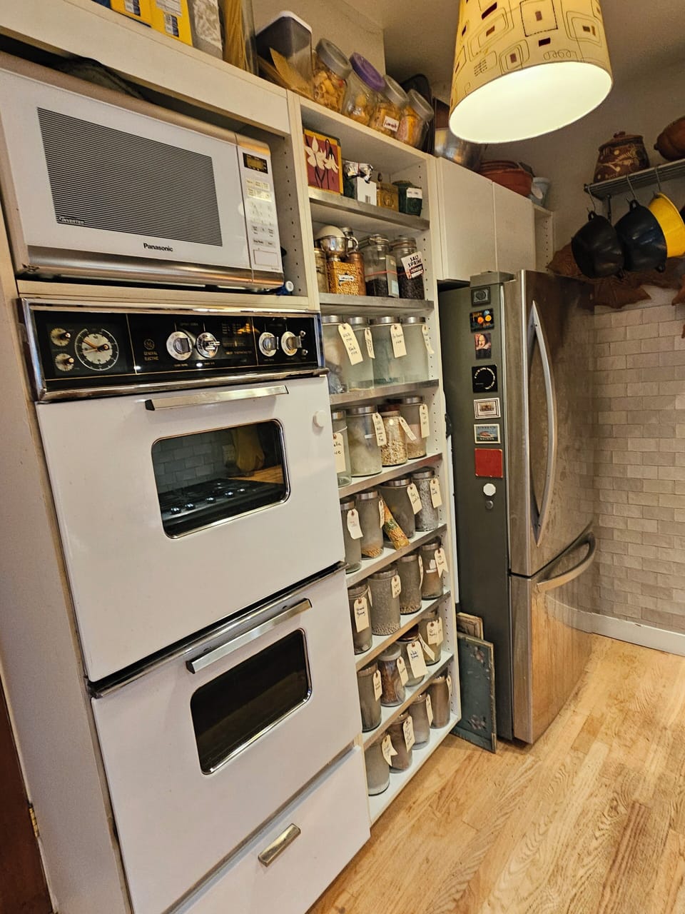 kitchen with 2 ovens, microwave and LG fridge with pull-out freezer.