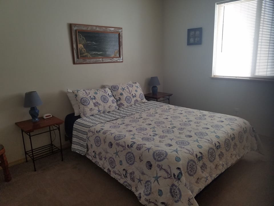 Main floor bedroom 2 has a queen bed